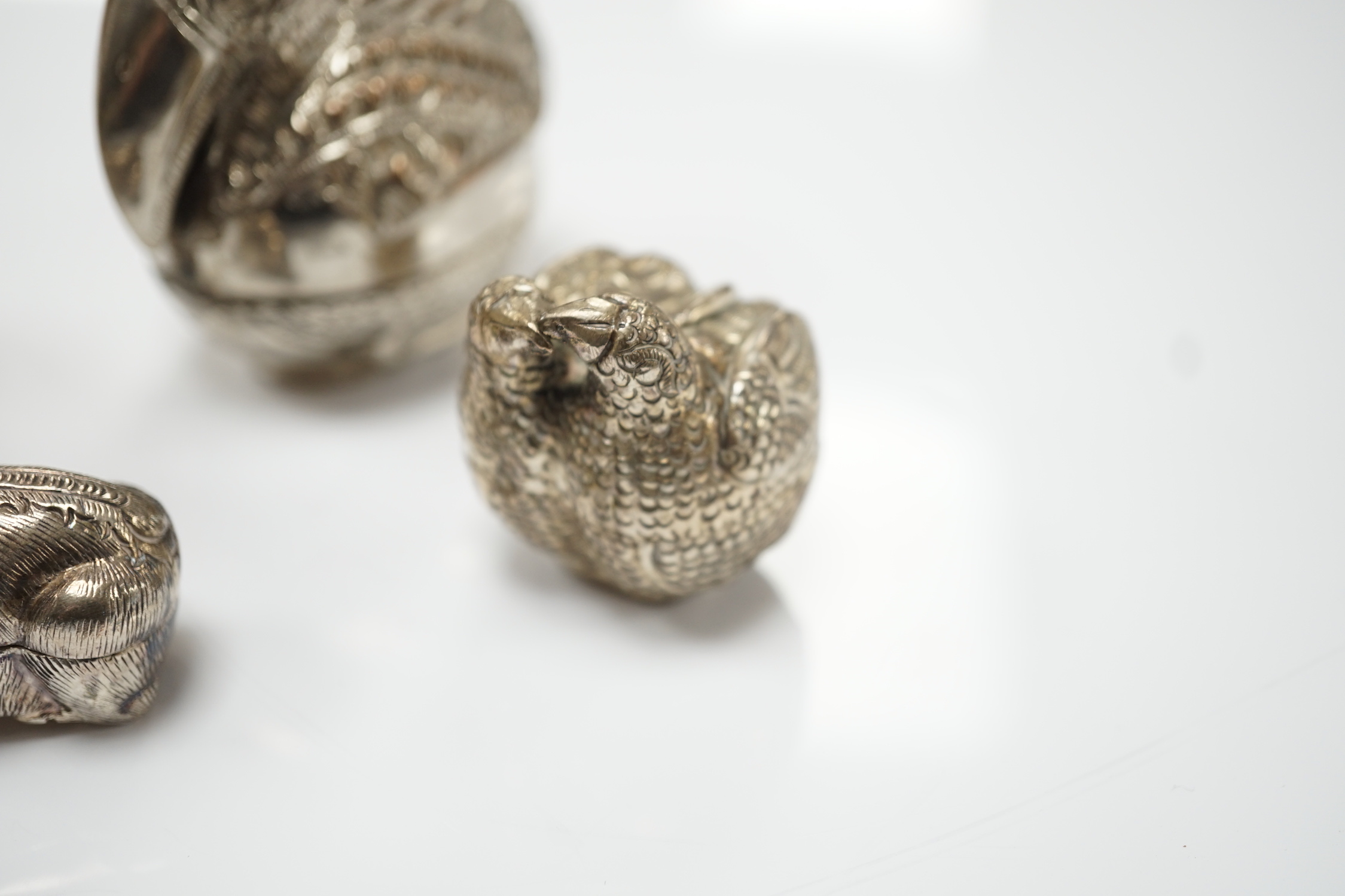 Four South East Asian white metal small ‘animal’ boxes. Largest 6cm